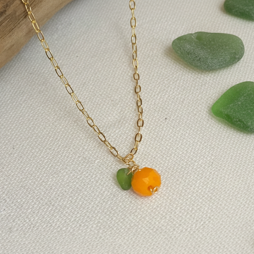 orange fruit necklace with sea glass leaf 