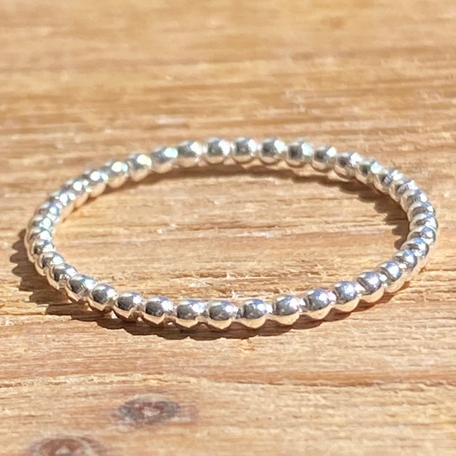 simple sterling silver ring with balls all around